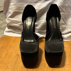Sky high 6” with 4”platform  , black satin pumps in near perfect condition. May